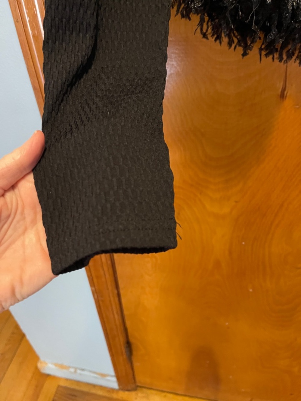 Anthropologie Black Long-Sleeve Cropped Top with Feathered Hem - Picture 4 of 8